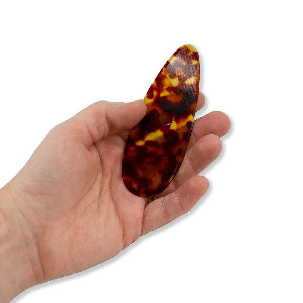 Flux Throwing Rib F3 held in potter’s hand for scale