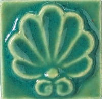 Pottery Patina reactive low fire glaze colour chip with green-blue glossy finish