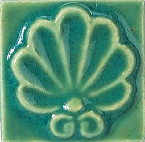 Pottery Patina reactive low fire glaze colour chip with green-blue glossy finish