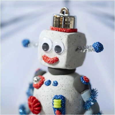 obot figure made using self-hardening Stone Clay with googly eyes and colourful decorations – fun arts and crafts for kids