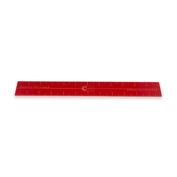Acrylic shrinkage ruler with 1/8 inch markings and pre-calculated shrinkage rates from 10% to 15%, for measuring clay and pottery pieces.